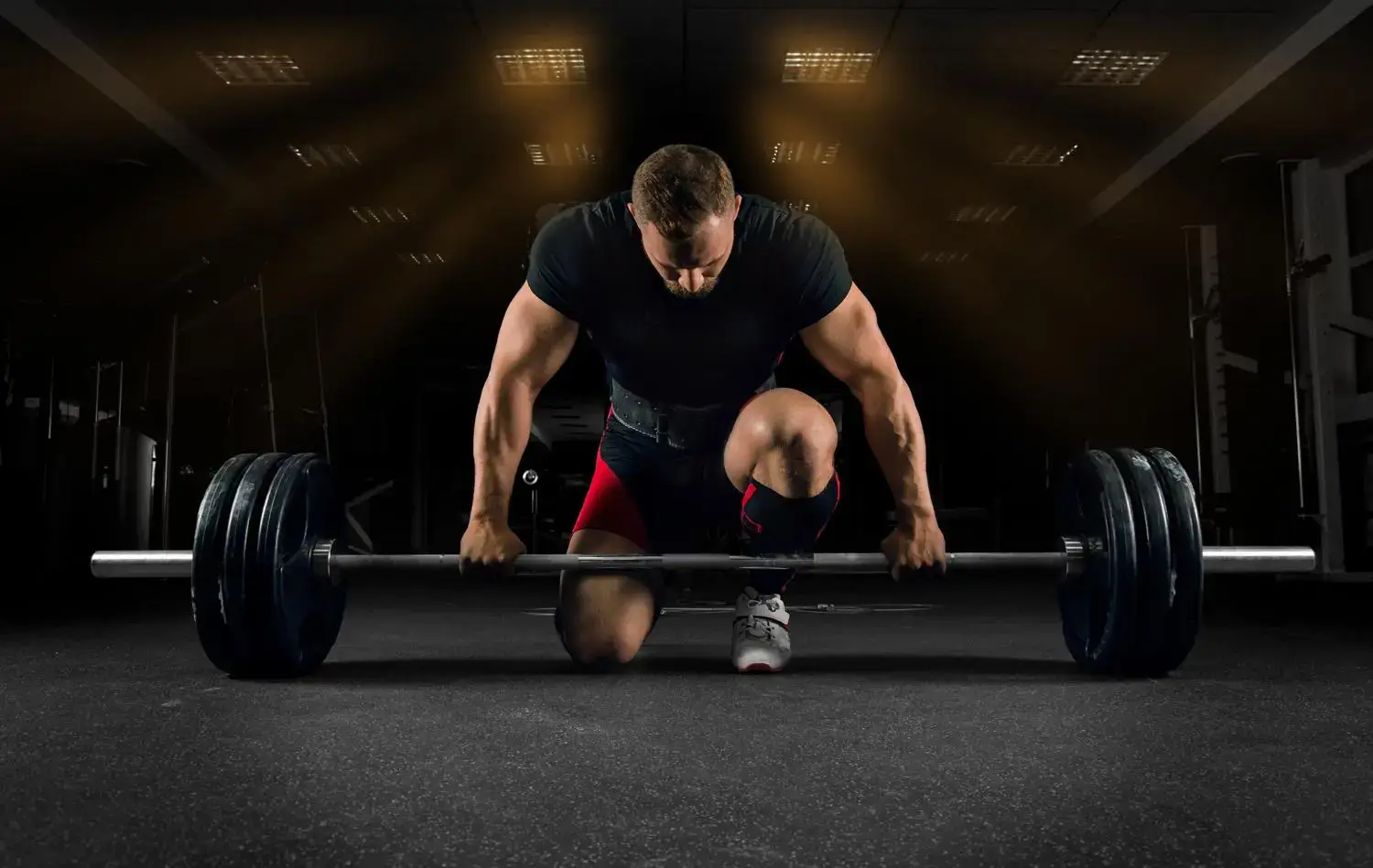 Athlete performing a deadlift in a modern gym