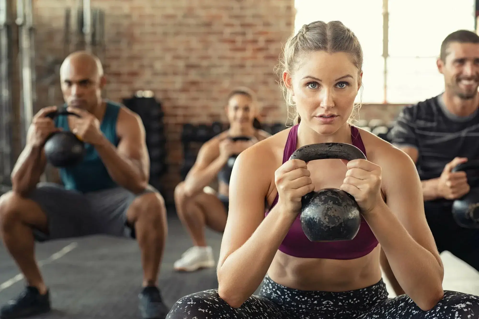 Person doing functional training with a kettlebell