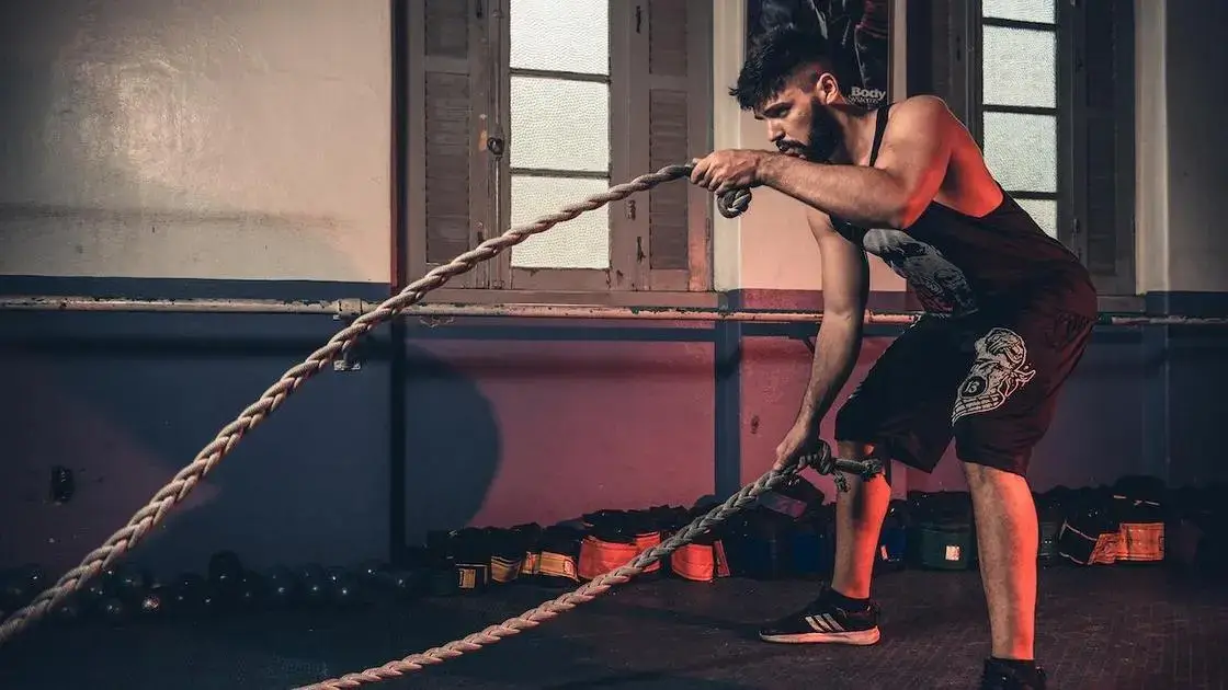Athlete using battle ropes during a HIIT workout