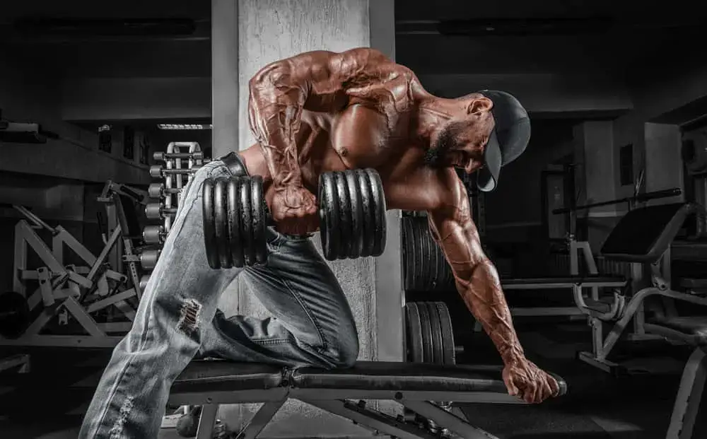 Man doing strength training with dumbbells