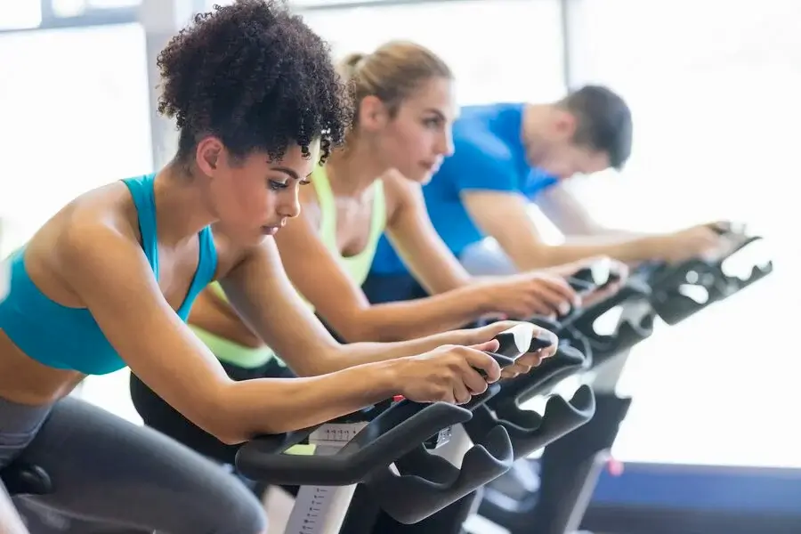 Trainer leading a high-energy spin class