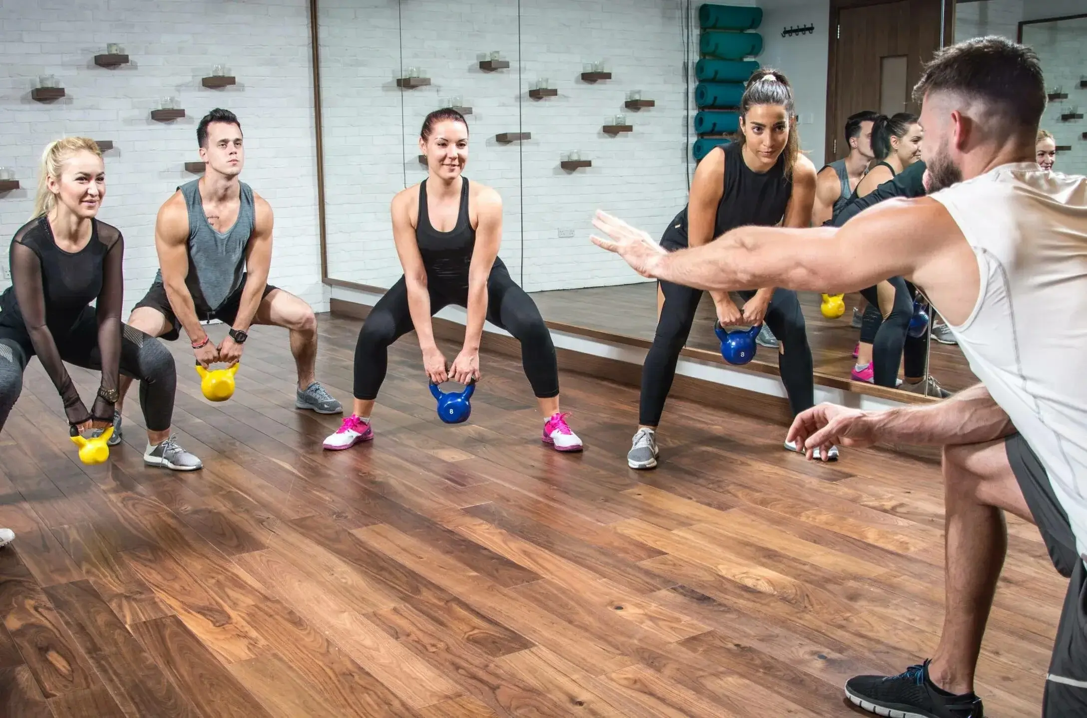 An energetic group fitness class with members motivating each other